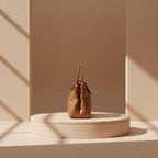 Brown handbag on a white background